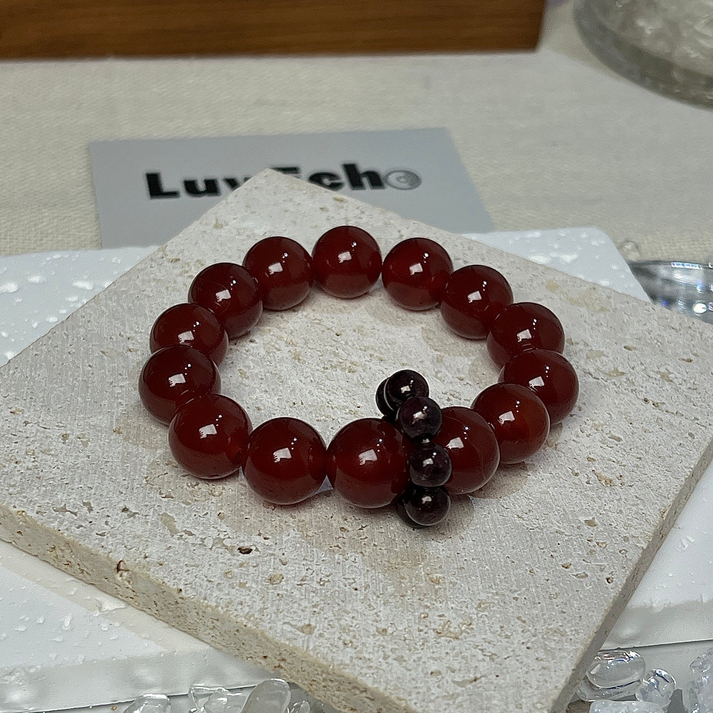 Detailed view of the Passion Loop Bracelet’s 4mm garnet small circle loop, symbolizing passion and energy flow.