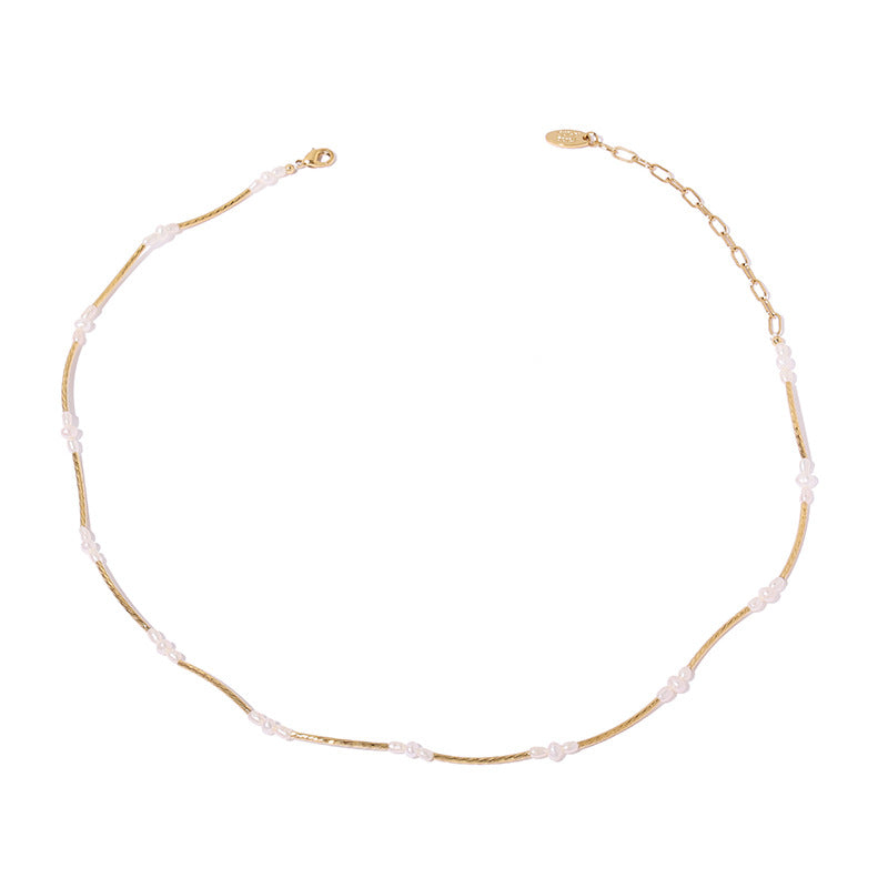 Close-up of the Elle Layered Pearl Shell Necklace details, highlighting exquisite pearls and delicate shells.