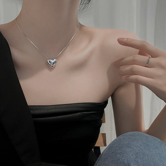 Bailey Bold Heart Necklace Styled Elegantly - Lifestyle Image by LuvEcho Jewelry