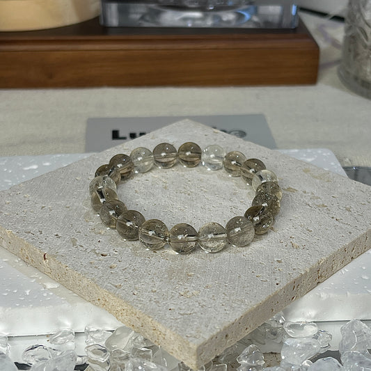 Healing bracelet with 8mm Smoky Azeztulite beads from LuvEcho Jewelry, focused on grounding and intuitive energy