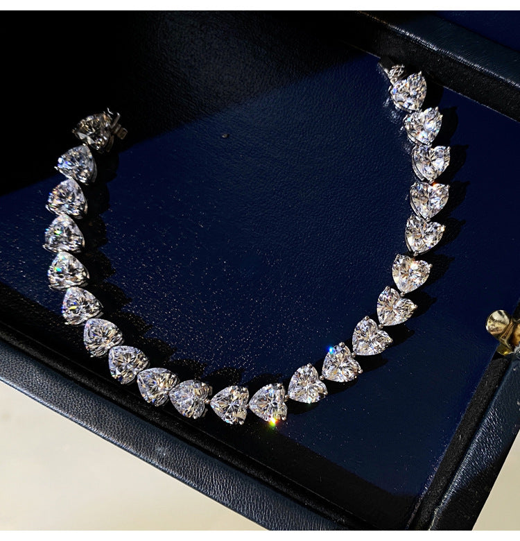 Close-up of the Sophia Bracelet, an elegant heart-shaped zircon bracelet, showcasing a delicate chain adorned with a mesmerizing heart-shaped zircon gemstone.