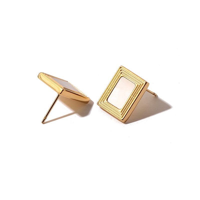 Close-Up of Diana LuvEcho Shell Inlaid Line Texture Titanium Stud Earrings - Textured and Elegant Design