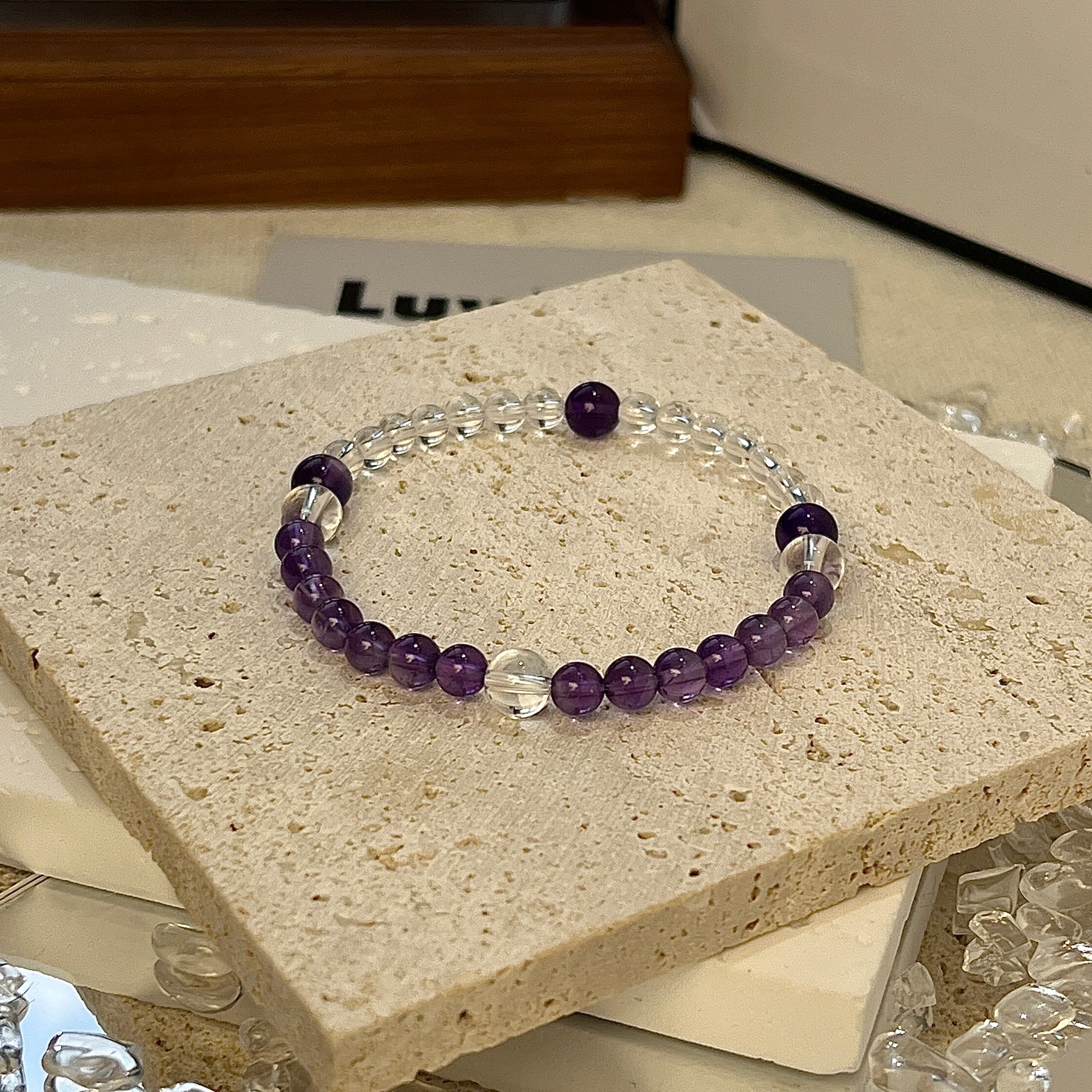 Divine Insight Bracelet from LuvEcho Jewelry, designed with 4mm-6mm Amethyst and Crystal Quartz beads for spiritual growth and focus