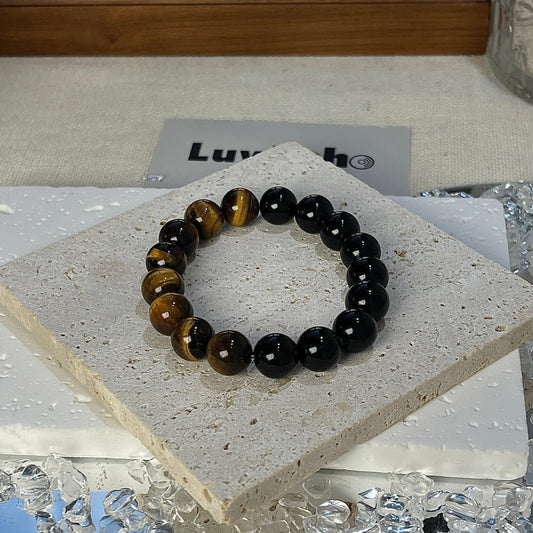 Empowered Strength Bracelet featuring 10mm Tiger Eye and Obsidian beads by LuvEcho Jewelry.