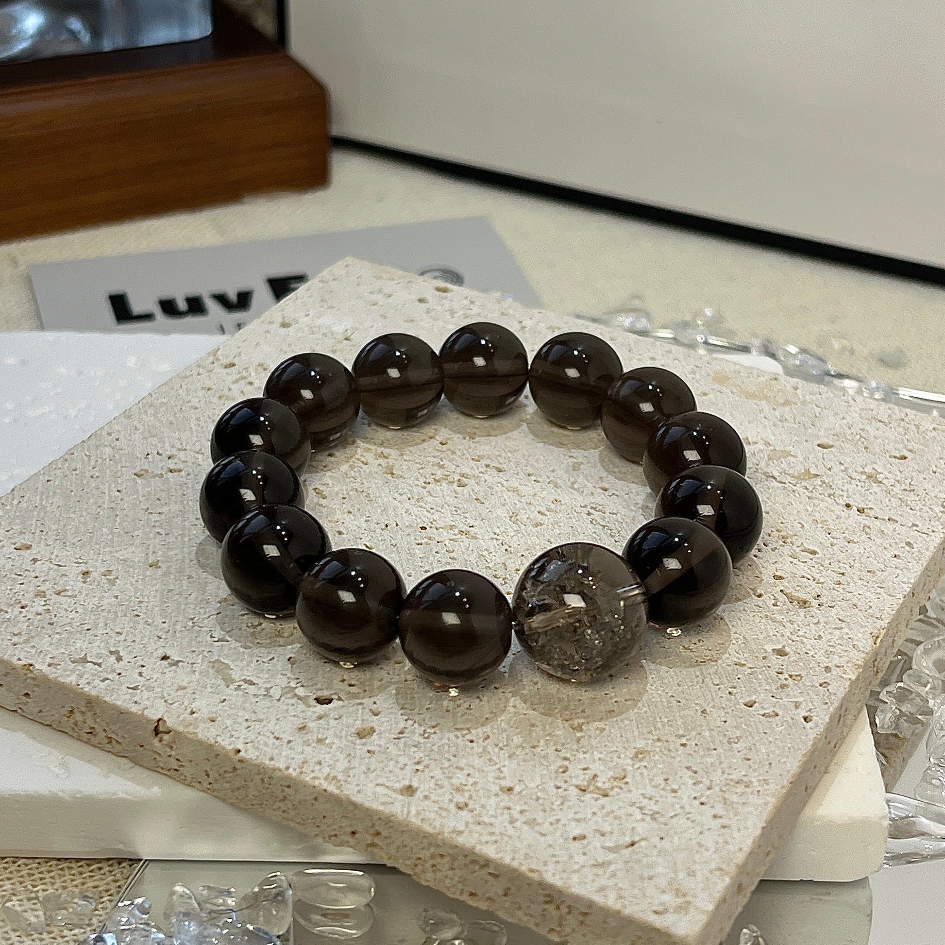 LuvEcho Jewelry Ethereal Strength Bracelet with a 14mm Smoky Azeztulite bead and 12mm Apache Tears beads, designed for emotional balance and spiritual healing