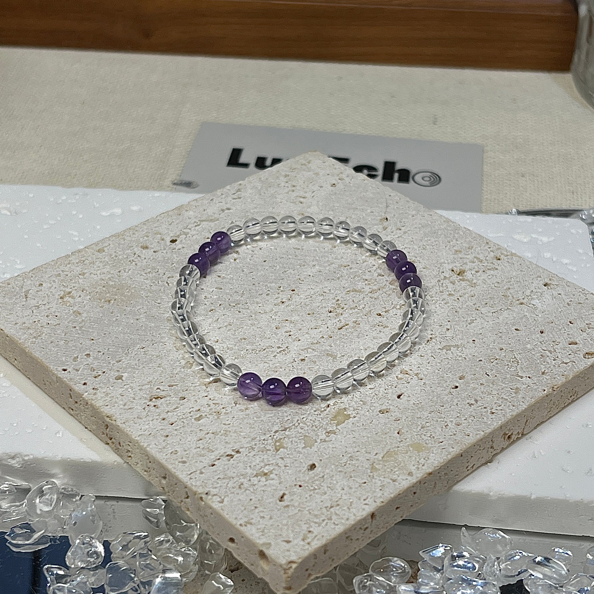 Harmonic Alignment Bracelet by LuvEcho Jewelry, featuring 4mm Crystal Quartz beads with three groups of 4mm Amethyst beads, each group containing three Amethyst beads for a balanced, spiritual design.