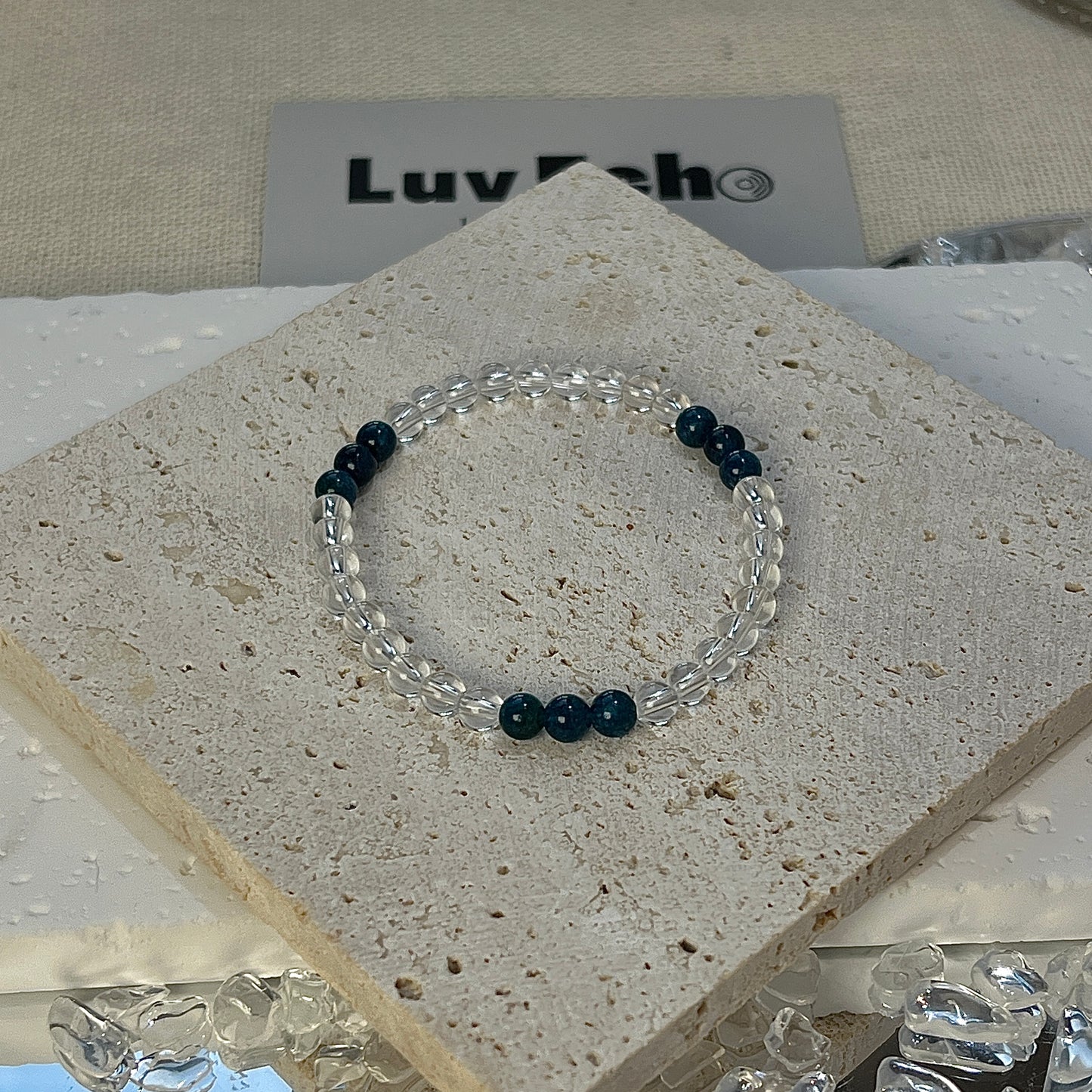 Harmonic Clarity Bracelet by LuvEcho Jewelry, featuring 4mm Crystal Quartz beads with three clusters of 4mm Blue Apatite beads, each cluster containing three Blue Apatite beads for a focused, balanced design.