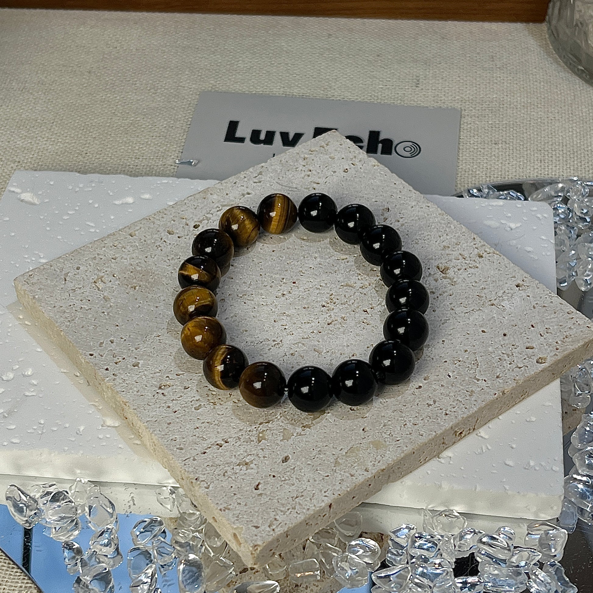 Empowered Strength Bracelet with alternating Tiger Eye and Obsidian beads, designed for protection and confidence.