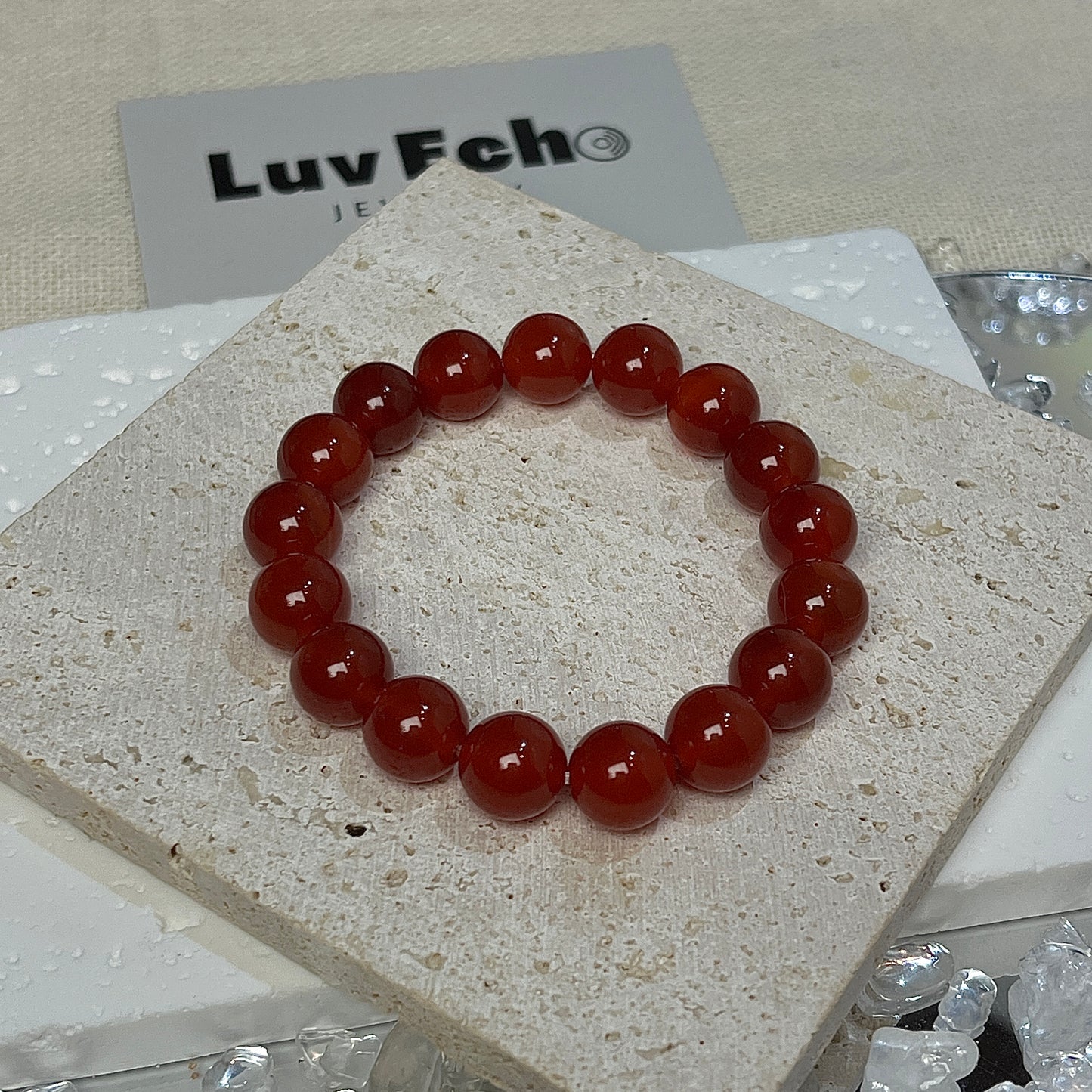 Radiant Energy Bracelet by LuvEcho Jewelry, emphasizing the texture and quality of the 10mm Light Red Agate beads.