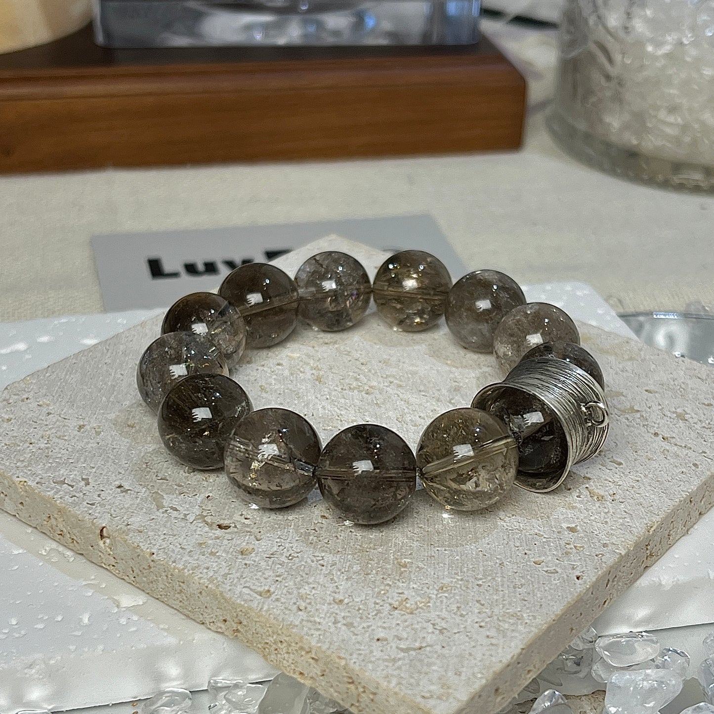 Vintage-inspired LuvEcho Jewelry Smoky Azeztulite bracelet with grounding properties and a 925 silver accent ring symbolizing inner strength and clarity.