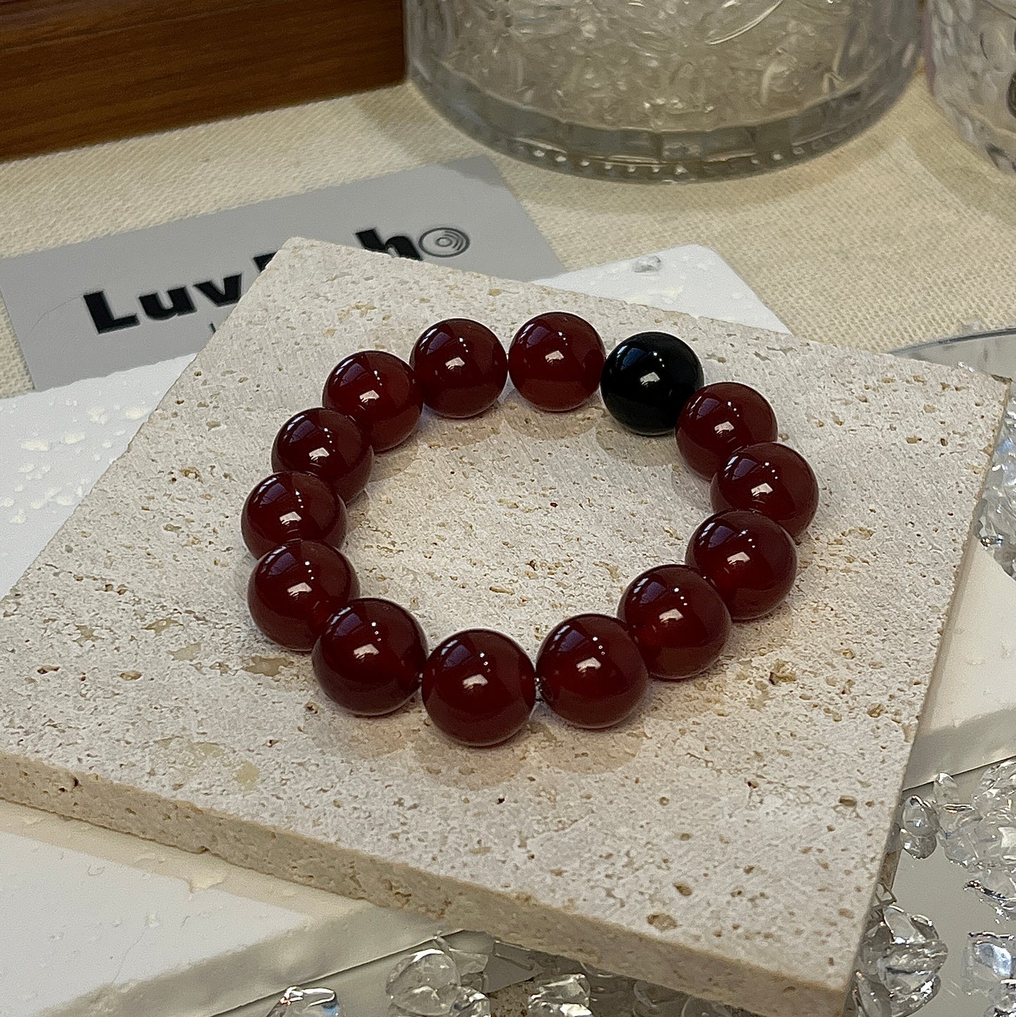 LuvEcho Jewelry Vibrant Shield Bracelet with 12mm Red Agate beads and a central Obsidian bead, designed for strength and protection