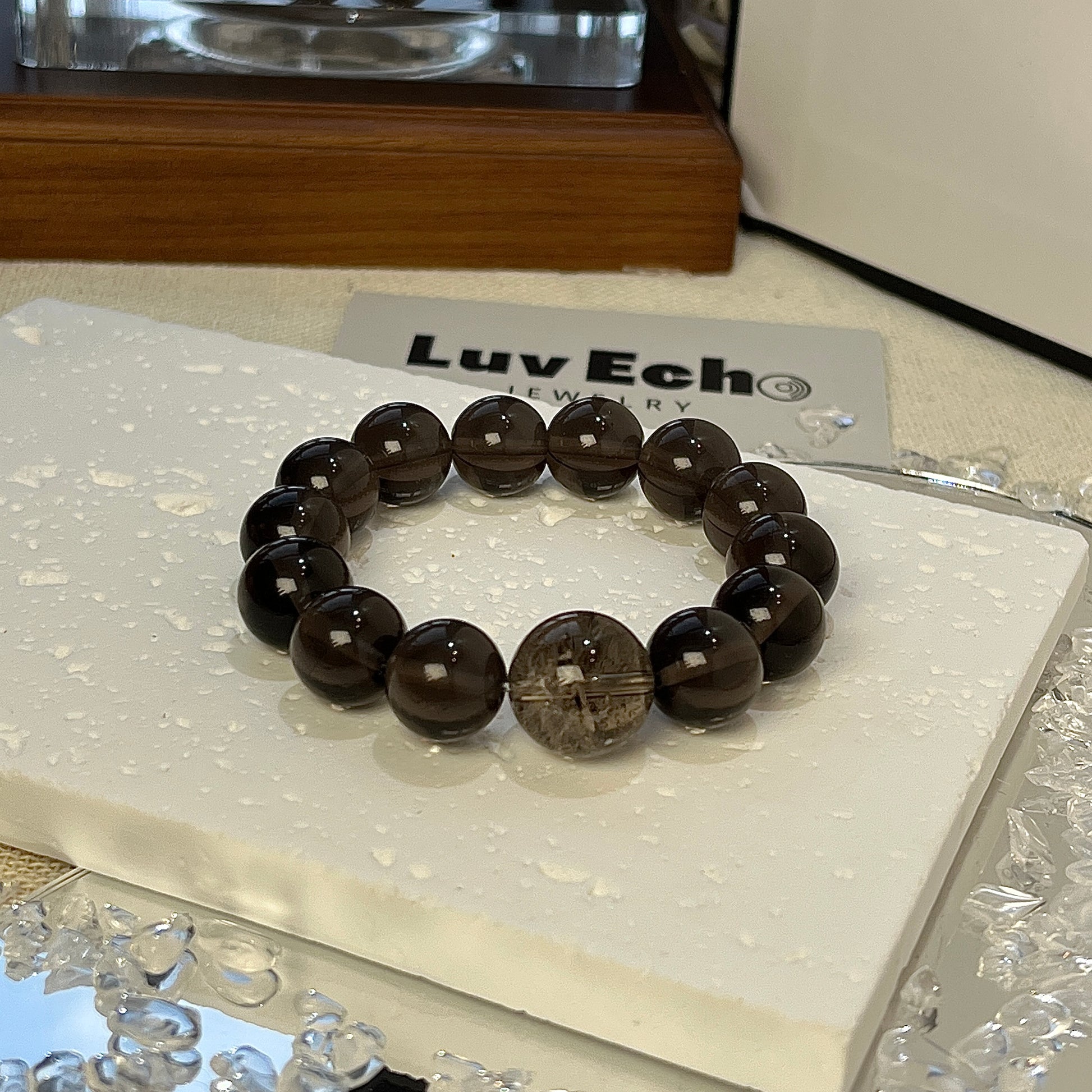 LuvEcho Jewelry Ethereal Strength Bracelet featuring 12mm Apache Tears beads and a 14mm Smoky Azeztulite bead for enhanced protection and deep healing