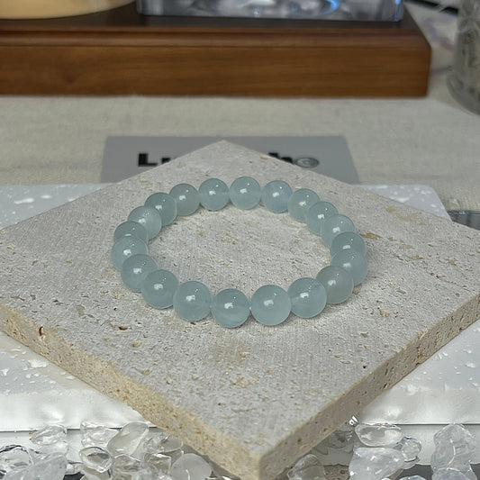 Ocean Breeze Bracelet featuring 8mm Aquamarine beads for tranquility from LuvEcho Jewelry.