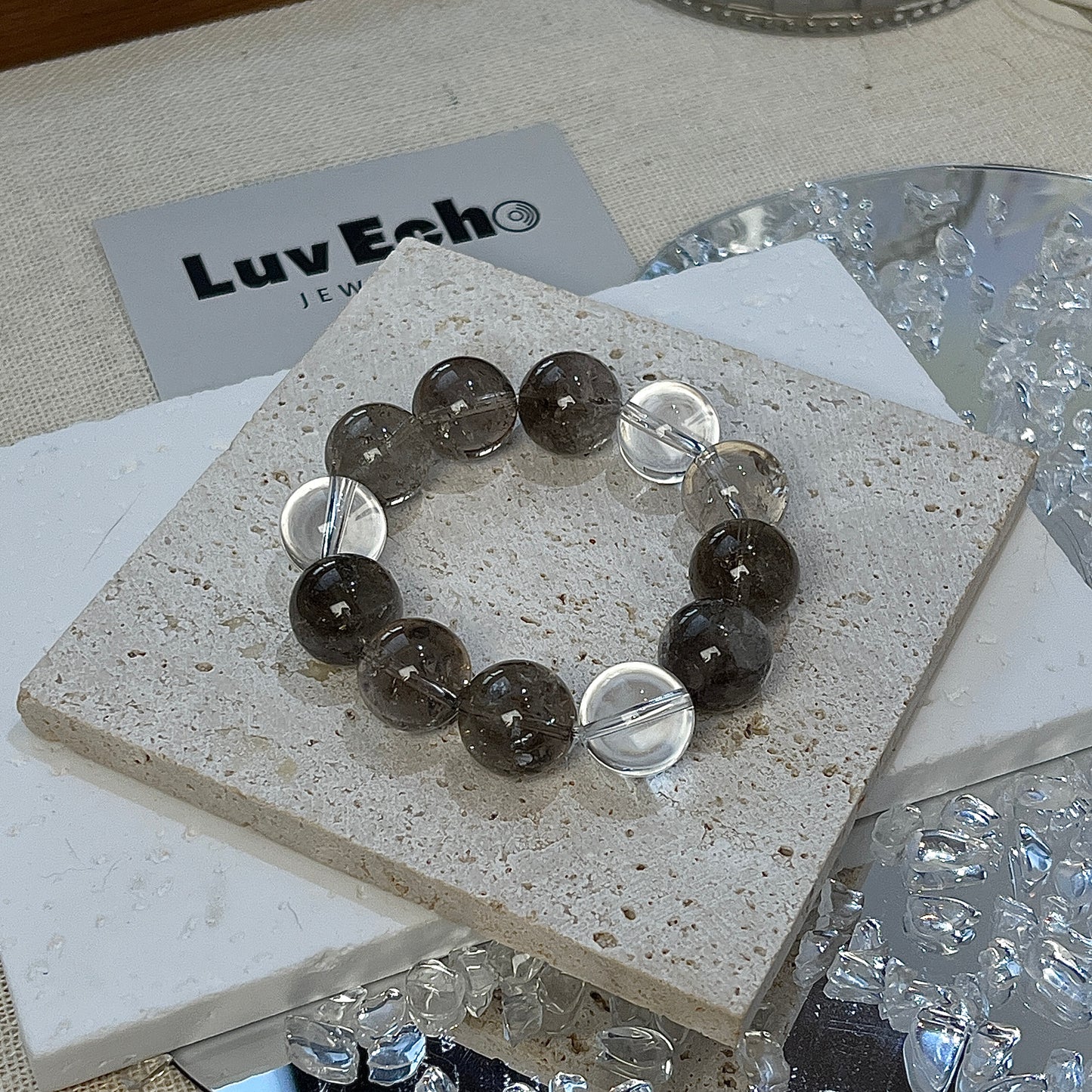 LuvEcho Jewelry bracelet with Smoky Azeztulite and Crystal Quartz, promoting emotional healing and clarity.