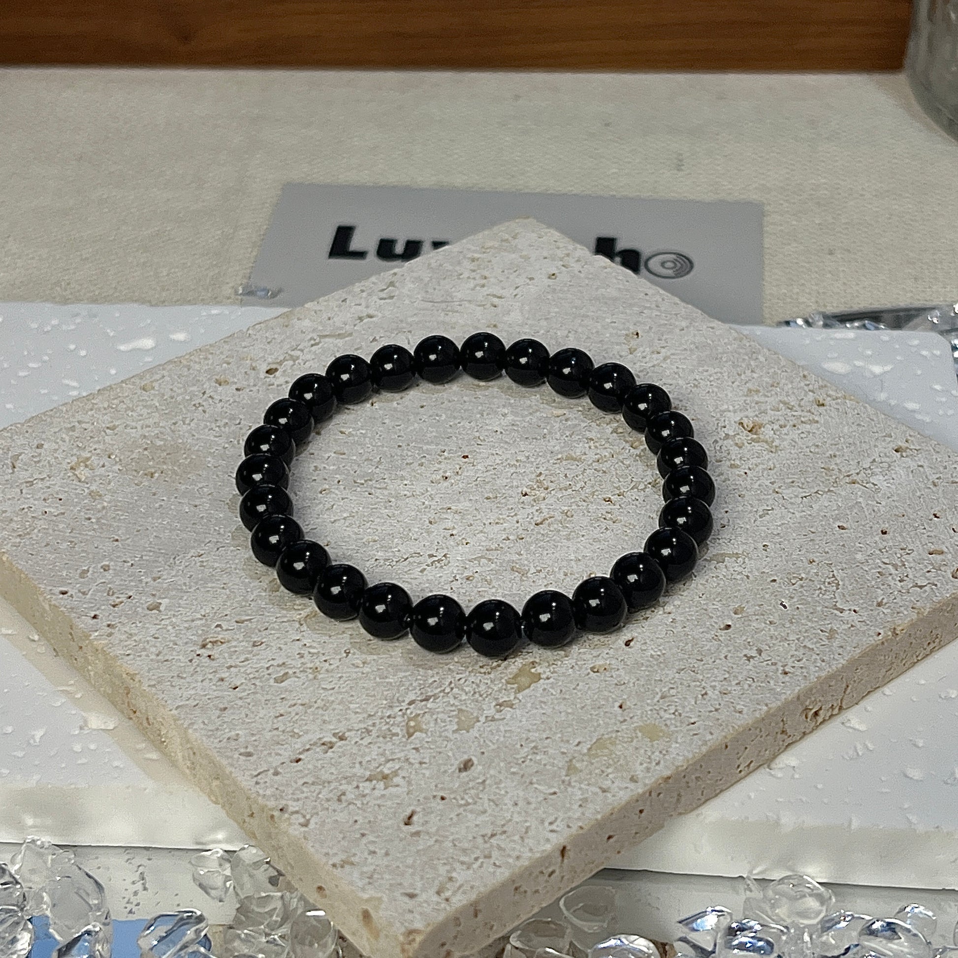 Elegant bracelet made with 6mm Obsidian, designed to shield against negative energy.