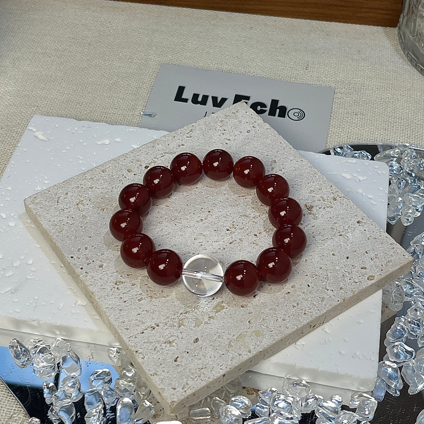 LuvEcho Jewelry Fearless Spirit Bracelet featuring 12mm Red Agate beads and a central 14mm Crystal Quartz bead.