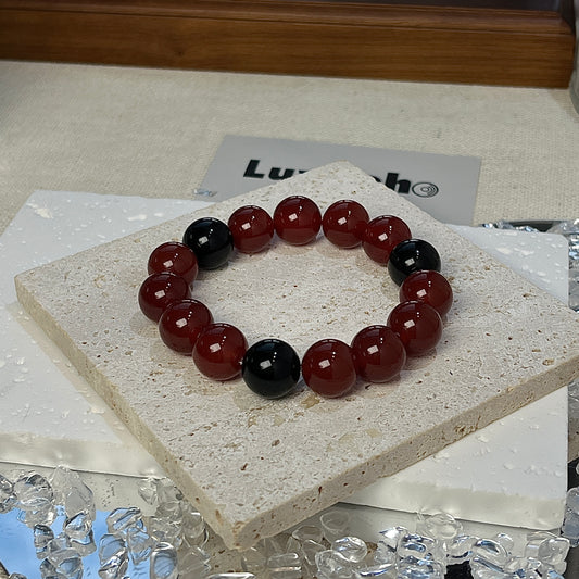 LuvEcho Jewelry Bold Resilience Bracelet featuring 12mm Red Agate beads and three separate Golden Sheen Obsidian beads.