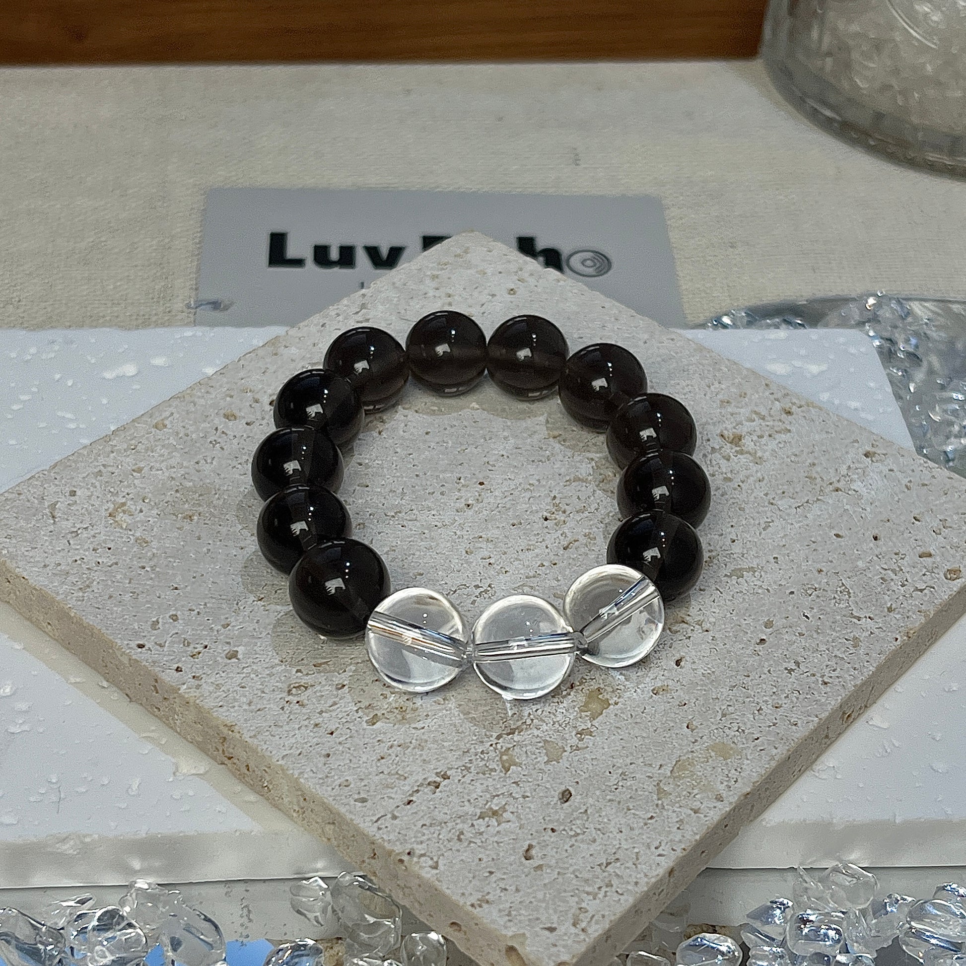 LuvEcho Jewelry Resilient Balance Bracelet featuring 12mm Apache Tears beads and three central Crystal Quartz beads.