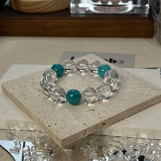 Serene Balance Bracelet featuring 12mm Amazonite beads and 12mm Crystal Quartz beads, designed for emotional stability.