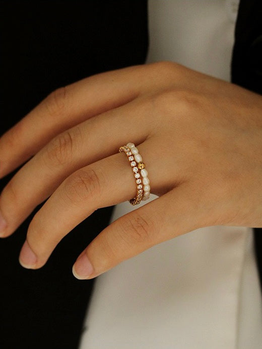 Close-up of Melina Pearl and Gold Ball Stackable Ring