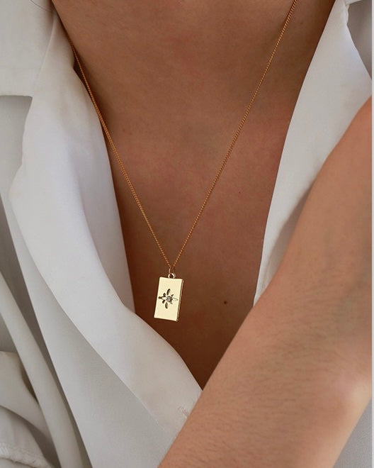 The Iris Octagonal Star Square Pendant Necklace by LuvEcho Jewelry, a chic and understated addition to your jewelry collection.