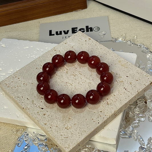 LuvEcho Jewelry Passionate Strength Bracelet featuring 12mm Red Agate beads, known for boosting confidence and emotional resilience