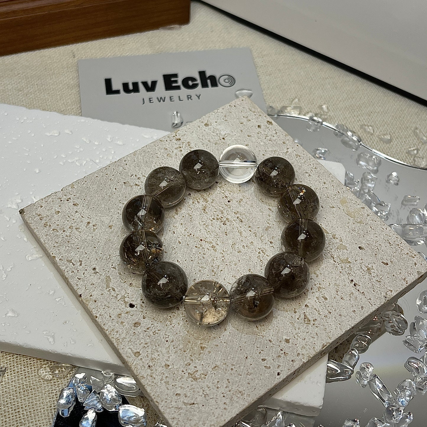 LuvEcho Jewelry’s Clarity & Grounding Bracelet with 14mm Smoky Azeztulite and a Crystal Quartz center.